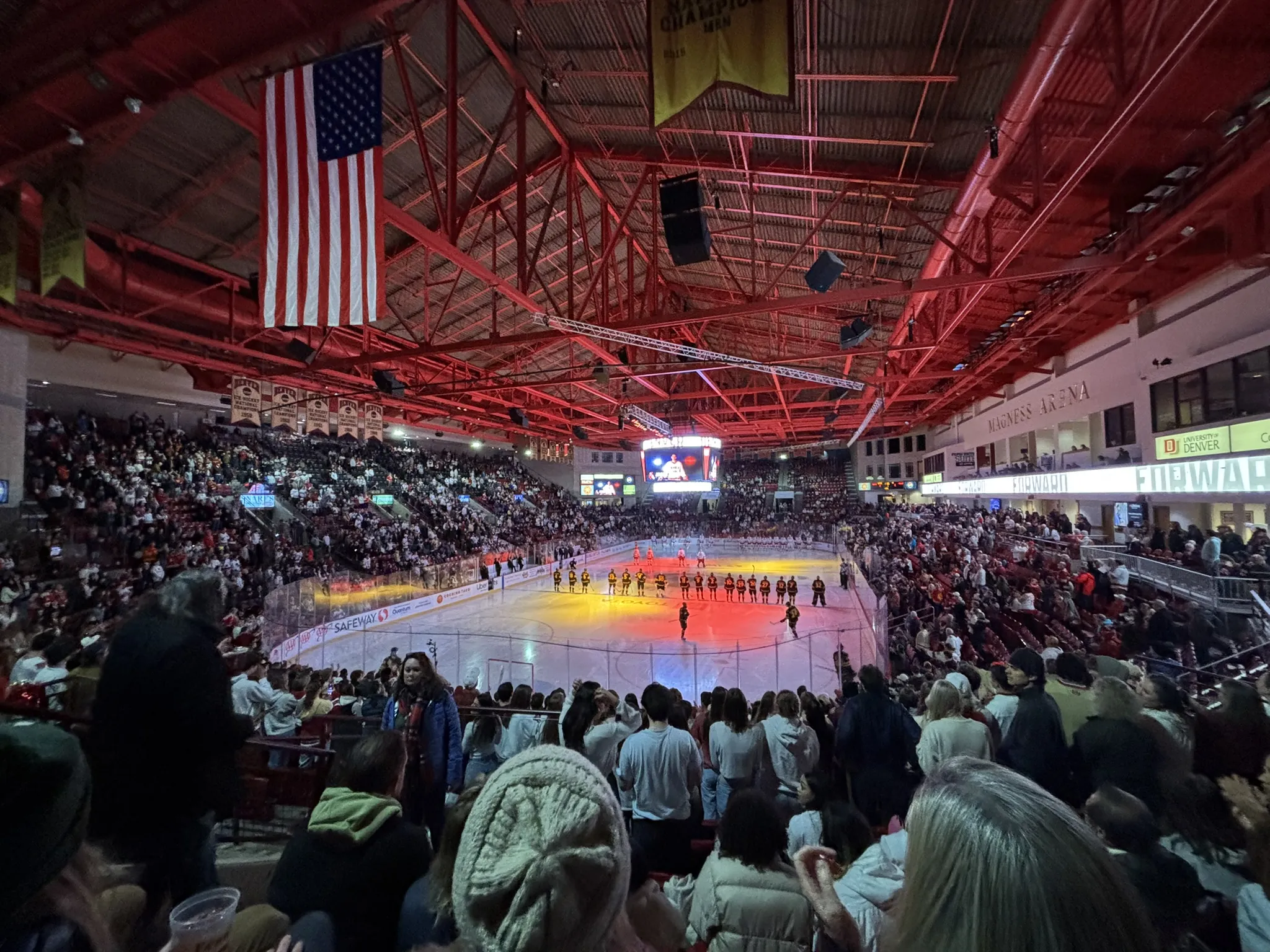 Pregame lights on the ice at a packed Magness Arena